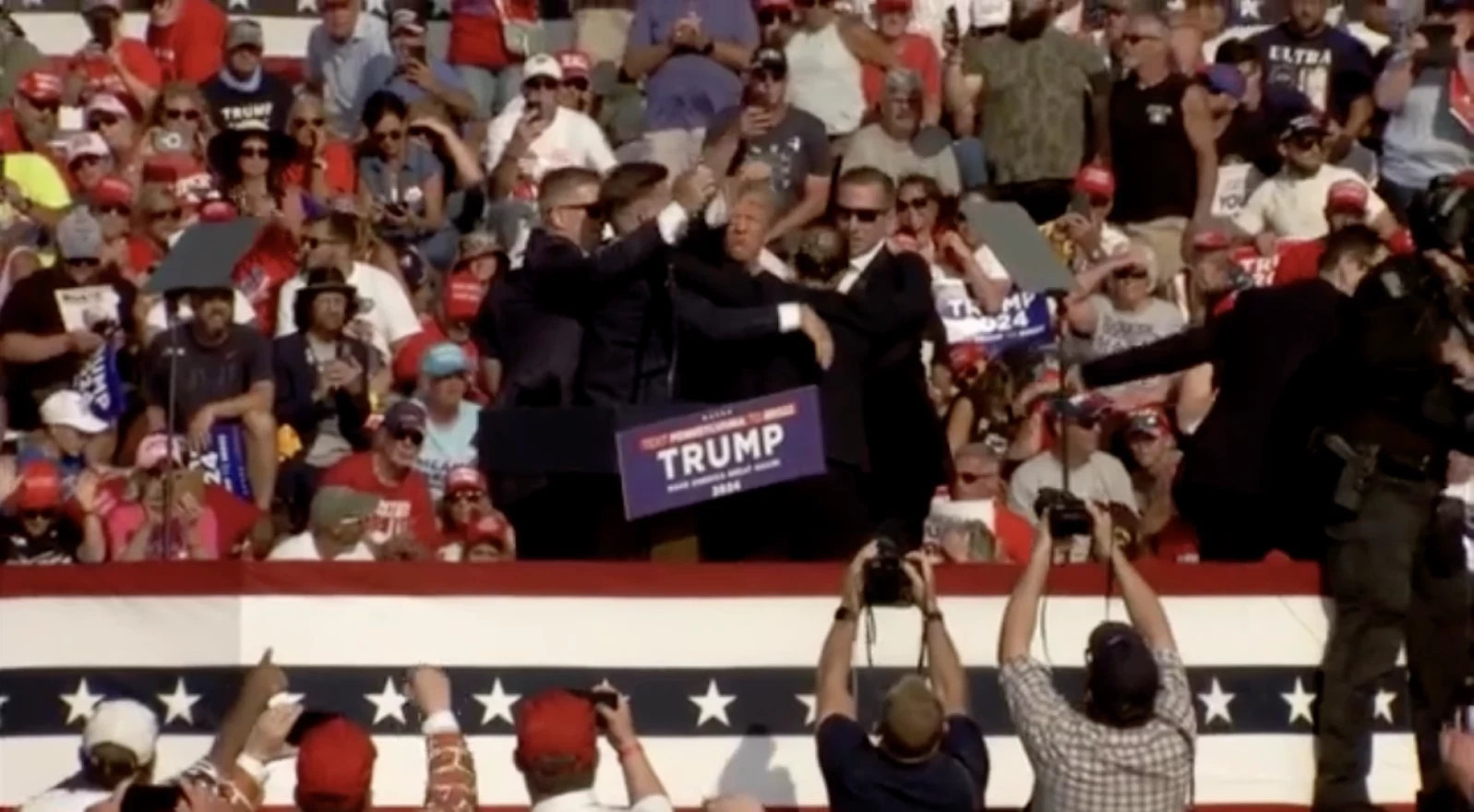 Screen shot of Secret Service on stage after a shooting at a Trump rally in Pennsylvania, July 13, 2024.